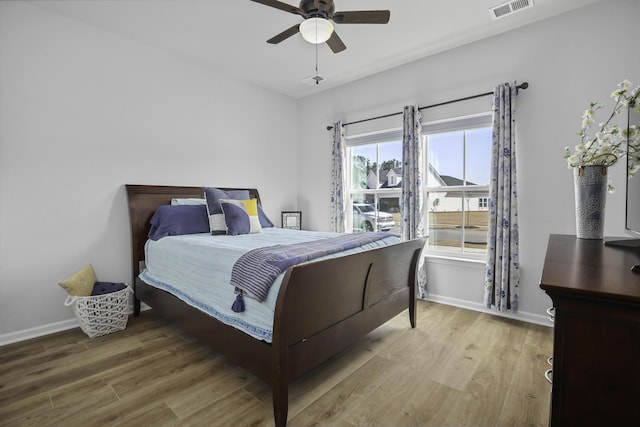 bedroom featuring hardwood / wood-style flooring and ceiling fan