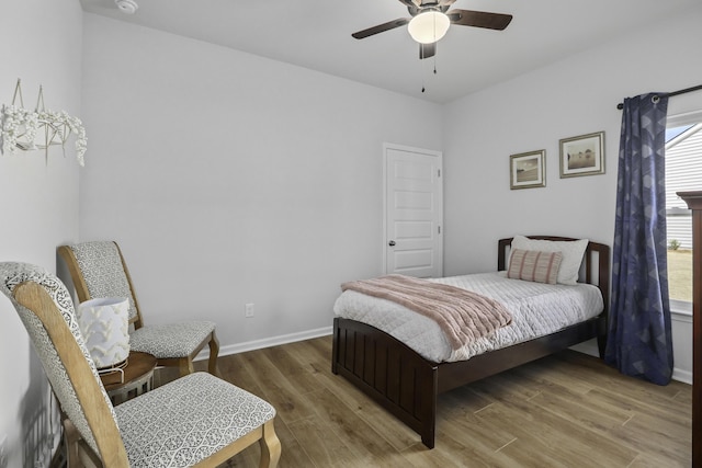 bedroom with hardwood / wood-style flooring and ceiling fan