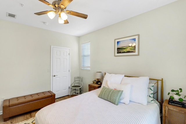 bedroom featuring ceiling fan and hardwood / wood-style floors