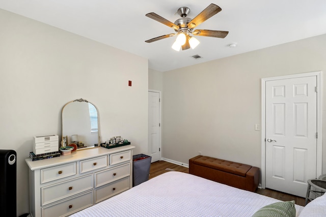 bedroom featuring dark wood-type flooring and ceiling fan