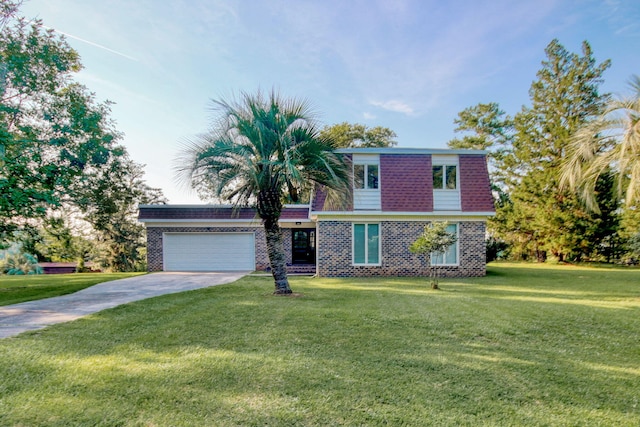 view of front of property with a garage and a front yard