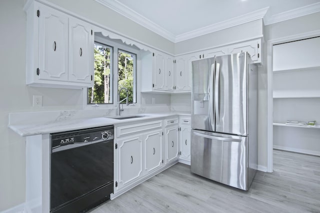 kitchen with sink, white cabinetry, crown molding, stainless steel fridge, and black dishwasher