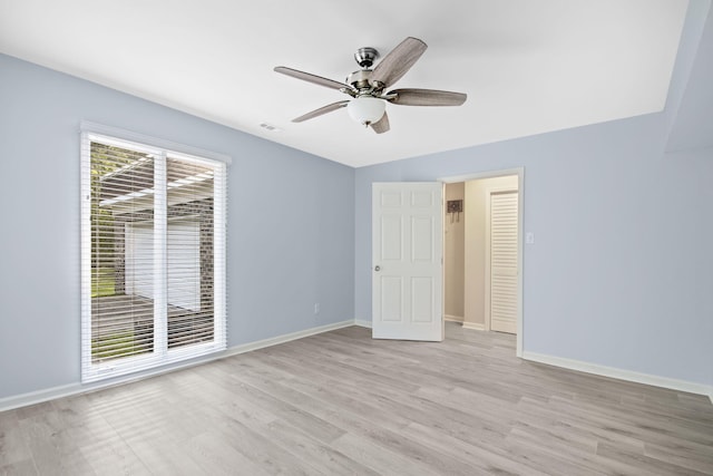 unfurnished bedroom with light hardwood / wood-style floors and ceiling fan