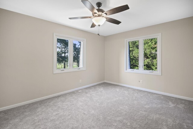 carpeted empty room with ceiling fan