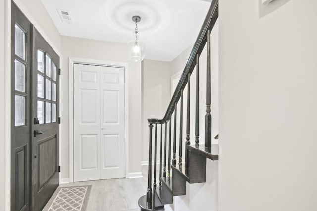 foyer entrance with light hardwood / wood-style flooring