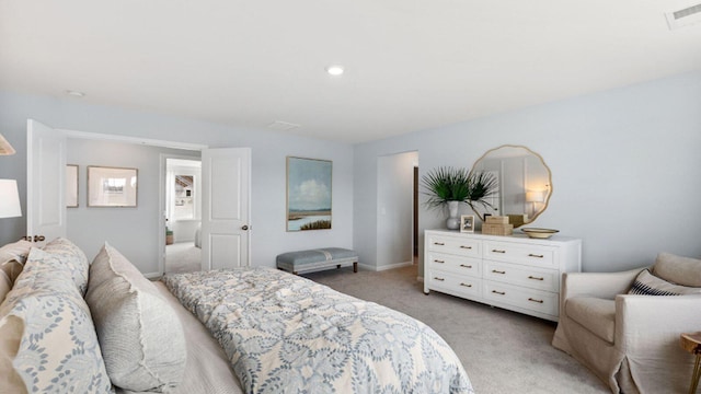 bedroom featuring light colored carpet, visible vents, and baseboards