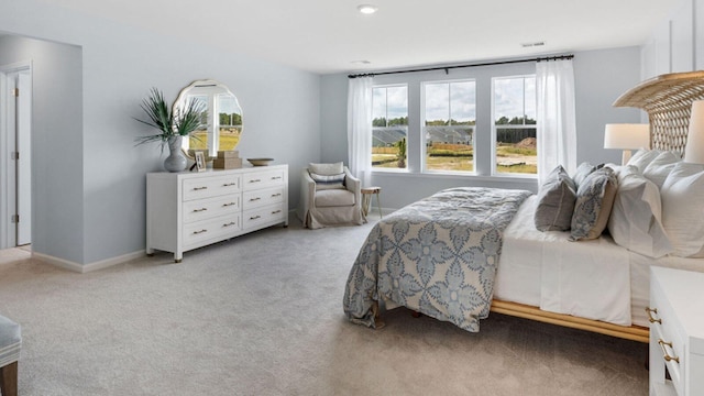 bedroom featuring carpet flooring, visible vents, and baseboards