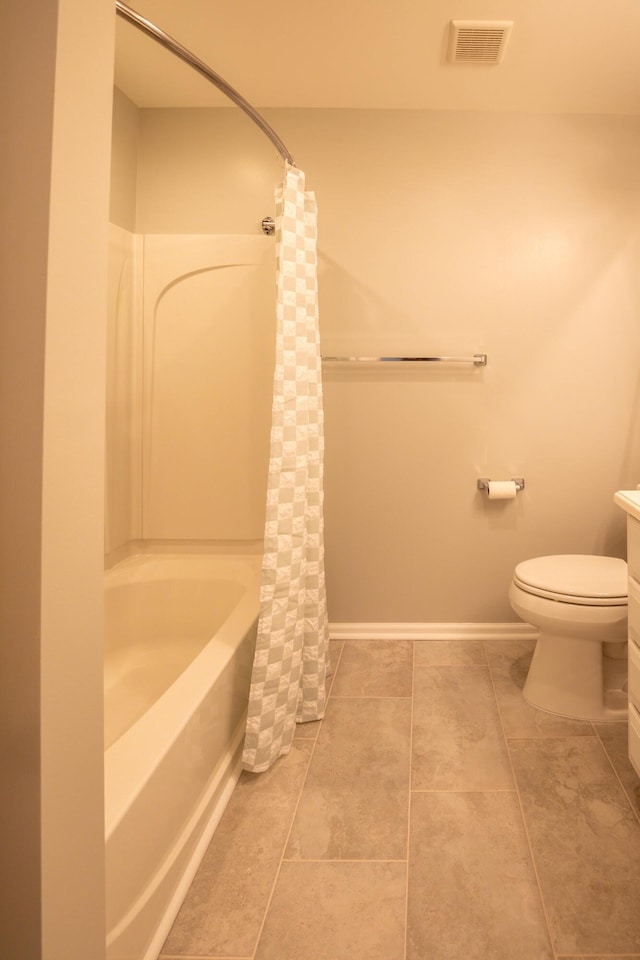 full bathroom with vanity, tile patterned floors, toilet, and shower / bath combo