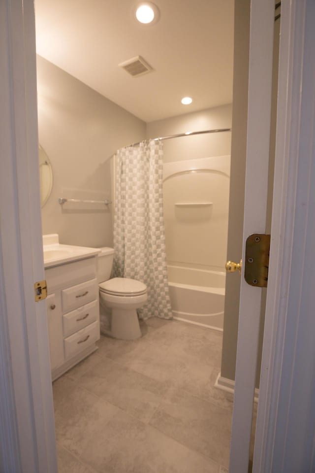 full bathroom featuring vanity, toilet, and shower / bath combo with shower curtain