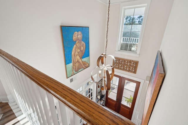 details with visible vents and a chandelier