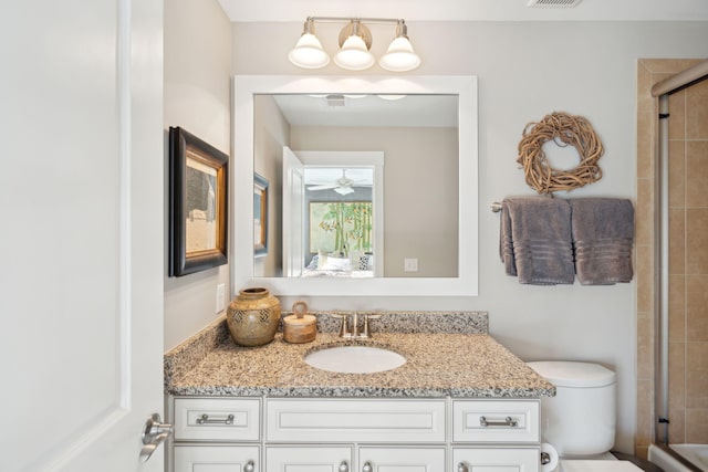 full bathroom featuring an enclosed shower, visible vents, toilet, a ceiling fan, and vanity