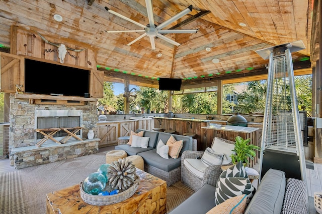 view of patio with a gazebo, area for grilling, and an outdoor living space with a fireplace