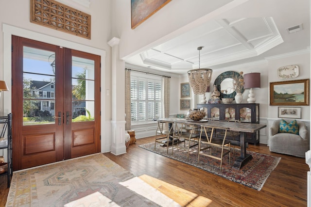 entryway featuring french doors, coffered ceiling, wood finished floors, and wainscoting