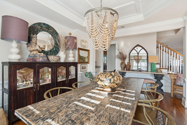 dining room with visible vents, crown molding, stairs, an inviting chandelier, and wood finished floors