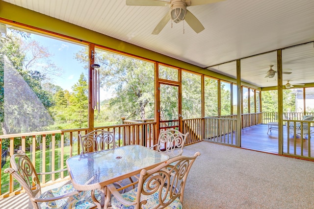 sunroom / solarium with ceiling fan