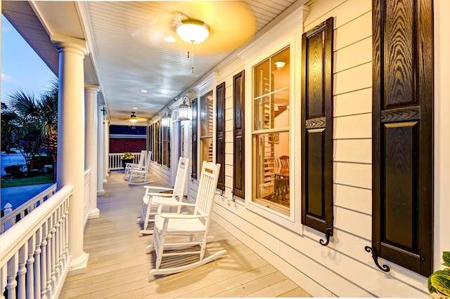 wooden terrace with a porch