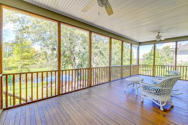 sunroom featuring ceiling fan