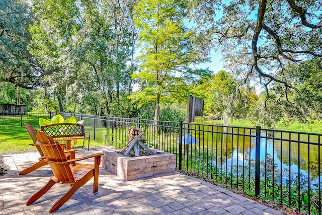 view of patio with a water view