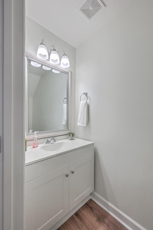 bathroom featuring hardwood / wood-style floors and vanity