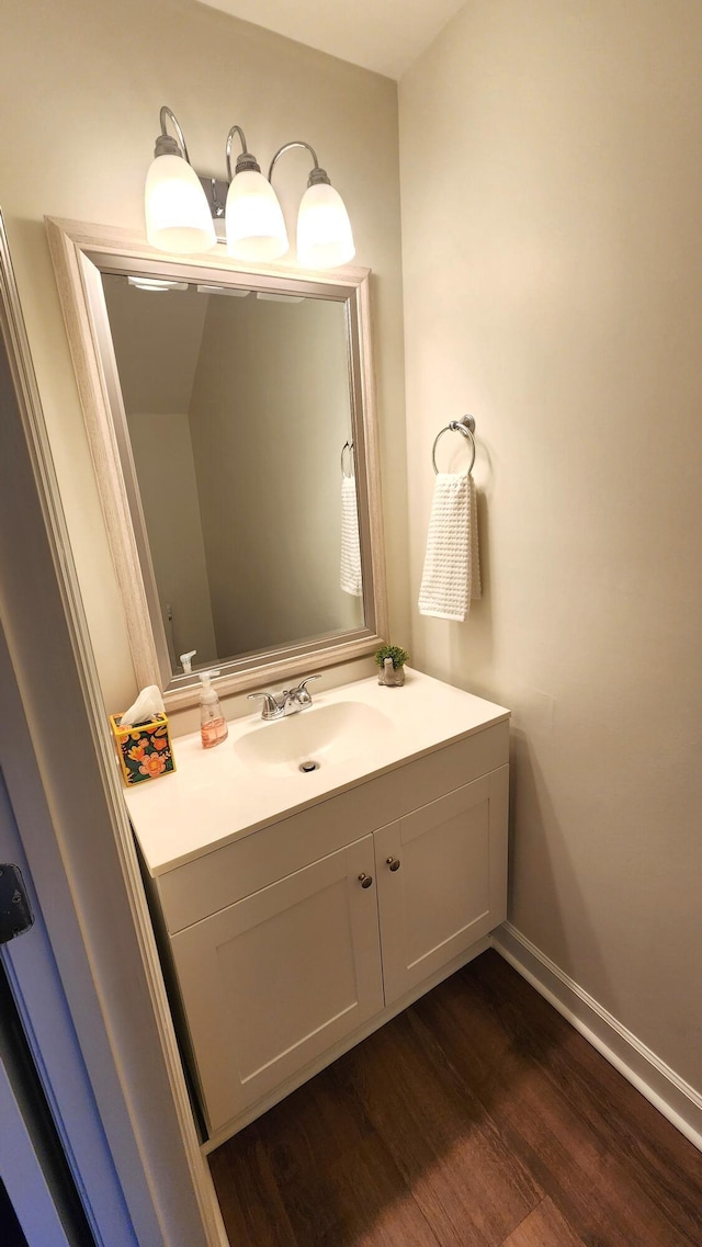 bathroom featuring hardwood / wood-style floors and vanity