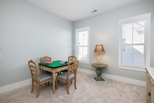 dining room with light carpet