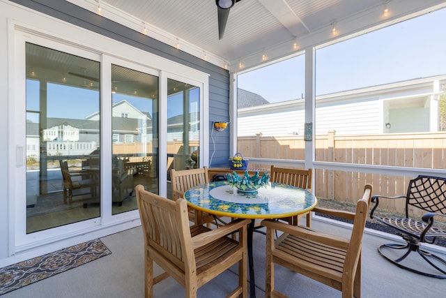 sunroom featuring track lighting