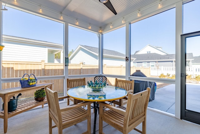 sunroom featuring track lighting