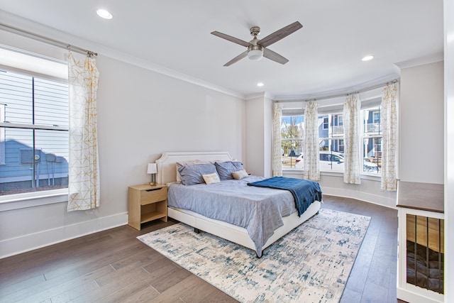 bedroom featuring baseboards, ornamental molding, wood finished floors, and recessed lighting