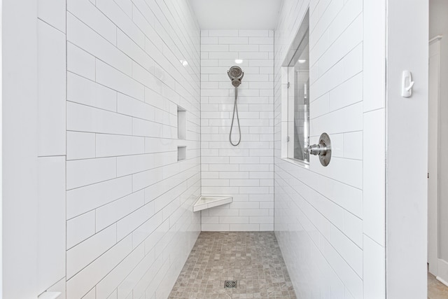 full bathroom with a tile shower