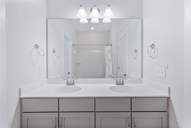 bathroom with double vanity, a sink, and a shower with curtain