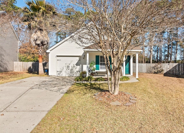 view of front facade with a front yard and a garage