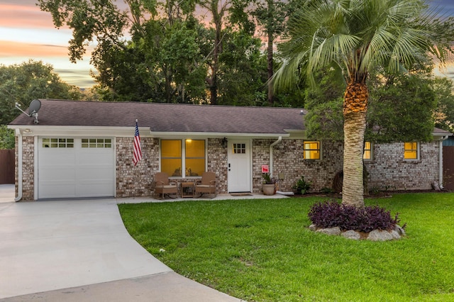 1990 Butternut St, Charleston, SC 29414 - ranch-style home with a garage, driveway, a lawn, a porch, and roof with shingles