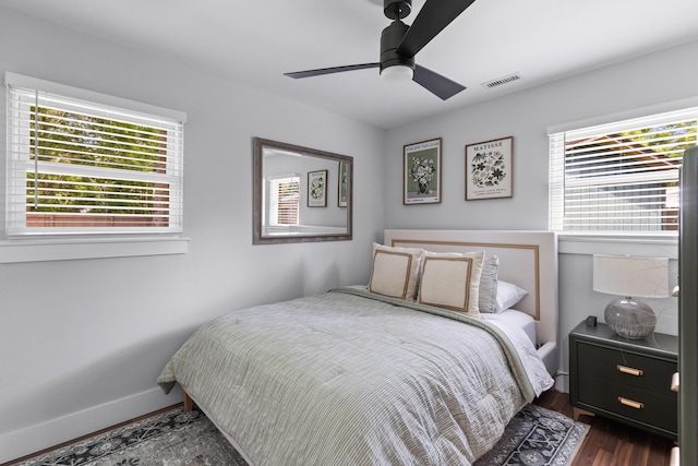1990 Butternut St, Charleston, SC 29414 - bedroom featuring multiple windows, dark wood-style flooring, and a ceiling fan