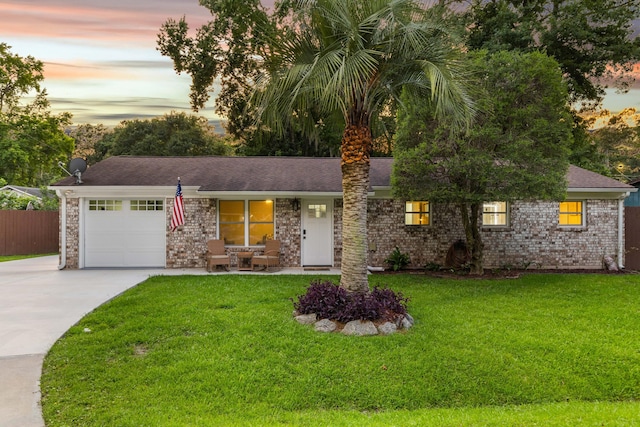 1990 Butternut St, Charleston, SC 29414 - view of front of home featuring concrete driveway, a garage, a shingled roof, and a porch
