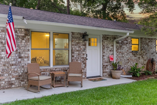 1990 Butternut St, Charleston, SC 29414 - doorway to property featuring a shingled roof and brick siding