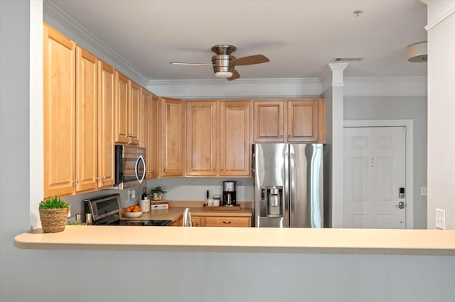 kitchen featuring visible vents, crown molding, ceiling fan, light countertops, and stainless steel appliances