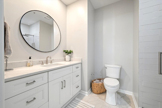 full bathroom featuring toilet, baseboards, marble finish floor, and vanity