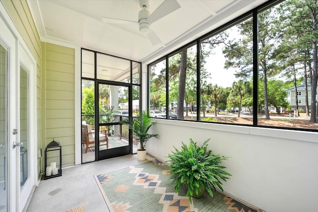 unfurnished sunroom with ceiling fan and a healthy amount of sunlight