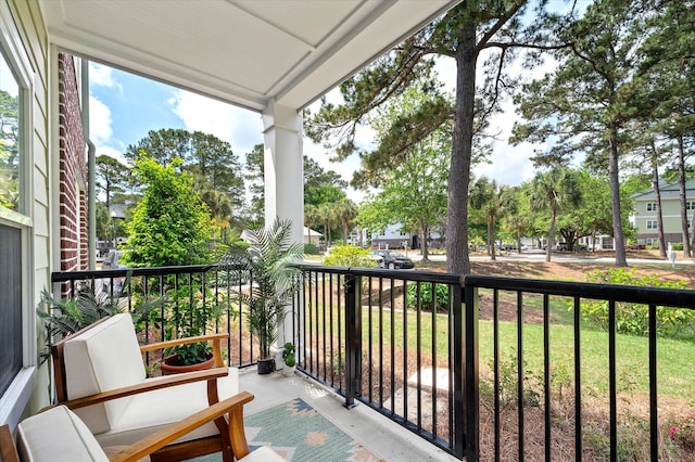 balcony with covered porch and a residential view