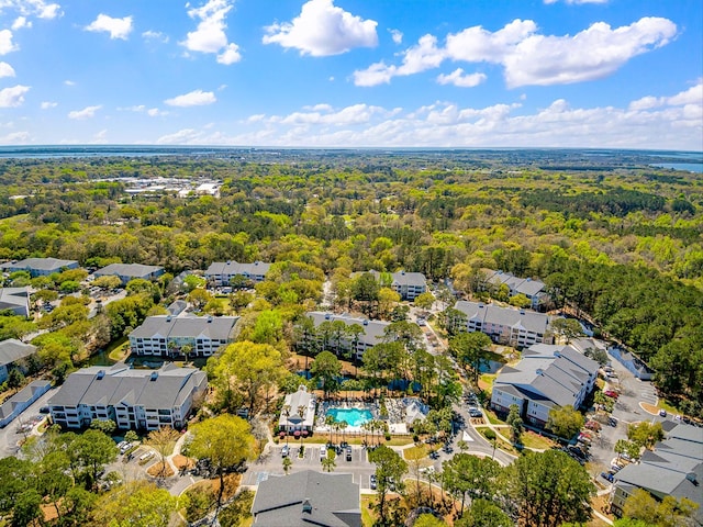 aerial view with a residential view and a view of trees