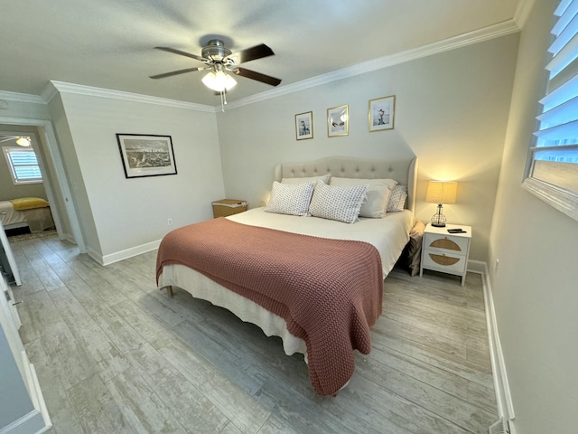 bedroom featuring a ceiling fan, crown molding, light wood-style floors, and baseboards