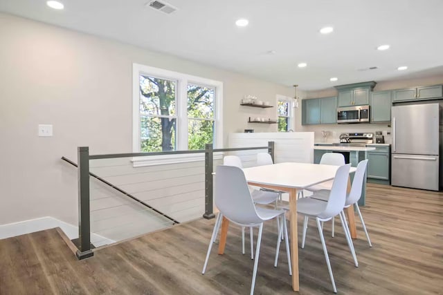 dining space featuring light hardwood / wood-style flooring