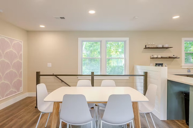 dining space featuring wood-type flooring