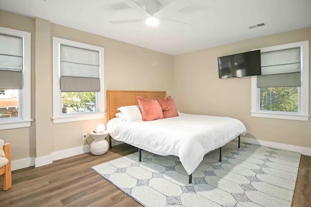 bedroom with hardwood / wood-style flooring and ceiling fan