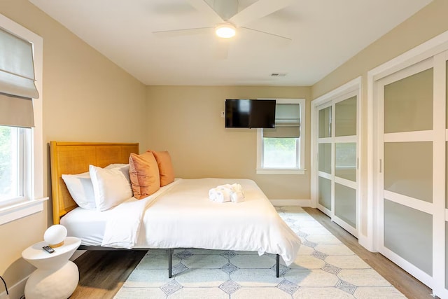 bedroom featuring ceiling fan and hardwood / wood-style floors