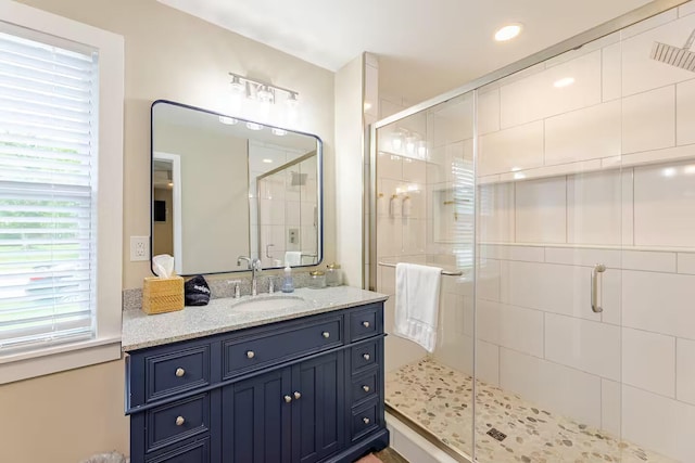 bathroom with vanity and an enclosed shower