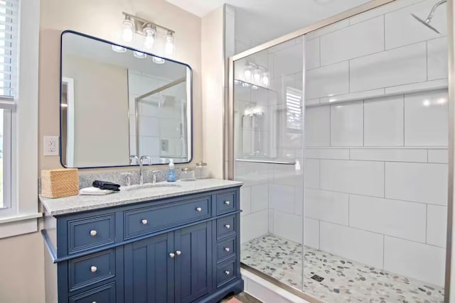 bathroom with vanity and walk in shower