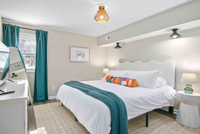 bedroom featuring wood-type flooring