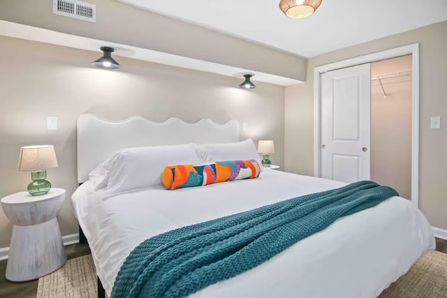 bedroom featuring hardwood / wood-style flooring and a closet