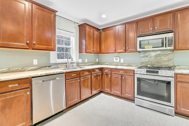 319 Deep River Rd, Summerville, SC 29486 - kitchen featuring light stone counters, sink, appliances with stainless steel finishes, and tasteful backsplash
